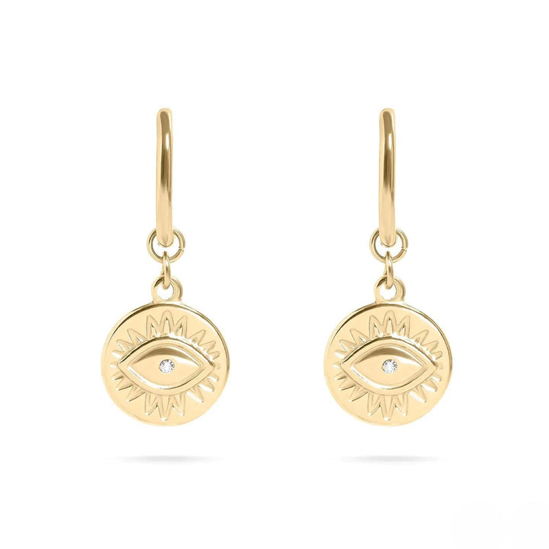 Gold earrings with eye design on a white background