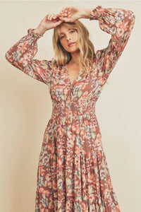 Close-up of V-neckline and shirred waist detail on floral midi dress