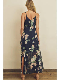 Woman wearing a floral dress with a plain background