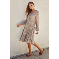 Model wearing Dress Forum ditsy floral scoop-neck tiered midi dress with tie neckline and bubble sleeves