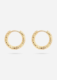 Gold hoop earrings with embedded stones on a white background