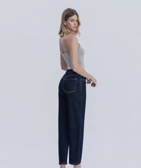 Back view of slim barrel jeans in dark wash denim