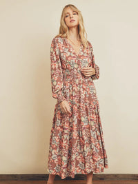 Model wearing Botanical Shirred Waist Tiered Dress in floral print with smocked waist and tiered skirt